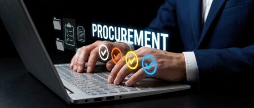 Image of someone typing on a laptop with the word Procurement